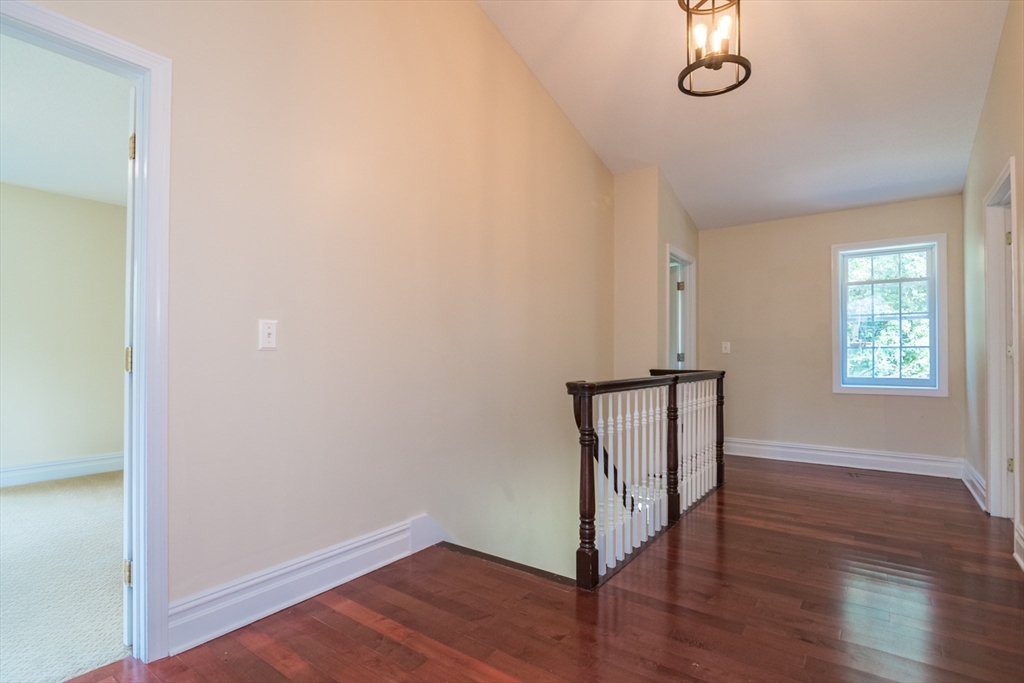 958 East Pleasant Street Amherst, MA 01002 - Photo 25 of 42 an empty room with wooden floor and window