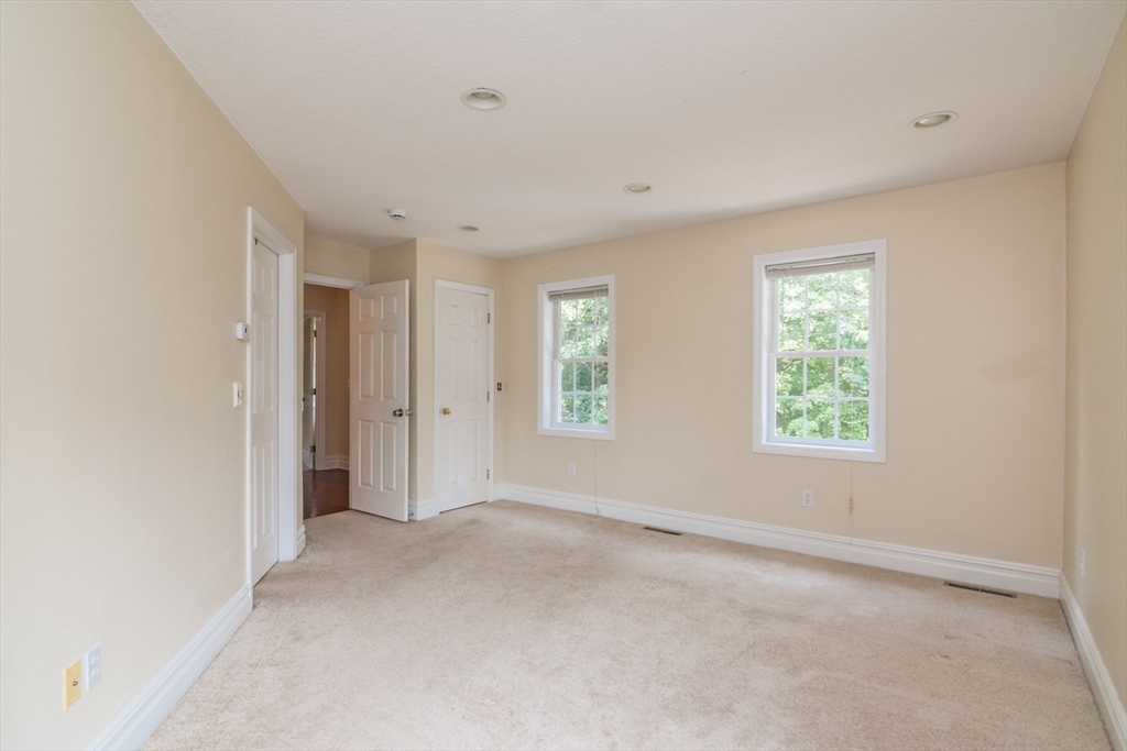 958 East Pleasant Street Amherst, MA 01002 - Photo 26 of 42 a view of an empty room with a window