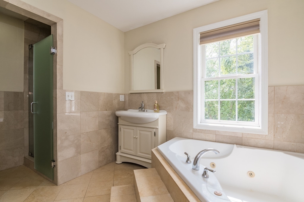 958 East Pleasant Street Amherst, MA 01002 - Photo 28 of 42 a bathroom with a tub sink and window