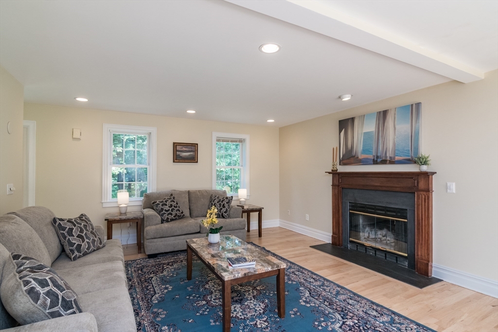 958 East Pleasant Street Amherst, MA 01002 - Photo 8 of 42 a living room with furniture a window and a fireplace