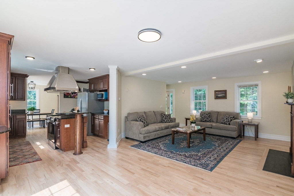 958 East Pleasant Street Amherst, MA 01002 - Photo 9 of 42 a living room with furniture and kitchen view