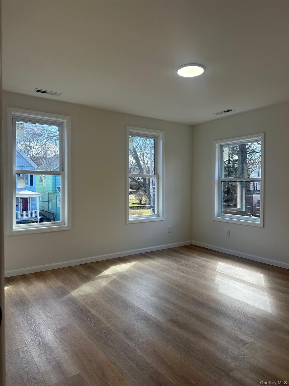 38 Carroll Street, Unit 2 Poughkeepsie, NY 12601 - Photo 7 of 8 a view of an empty room with windows