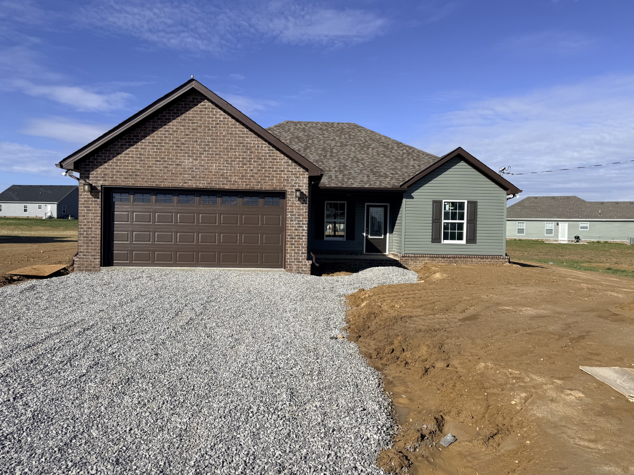 384 Ridge Street Manchester, TN 37355 - Photo 1 of 21 a front view of a house with a yard and garage