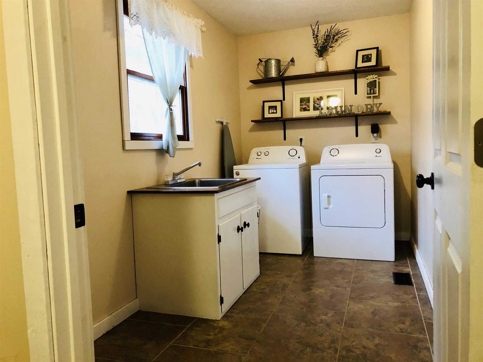1087 White Bluff Road White Bluff, TN 37187 - Photo 16 of 30 Laundry room right off from the kitchen and entrance from garage