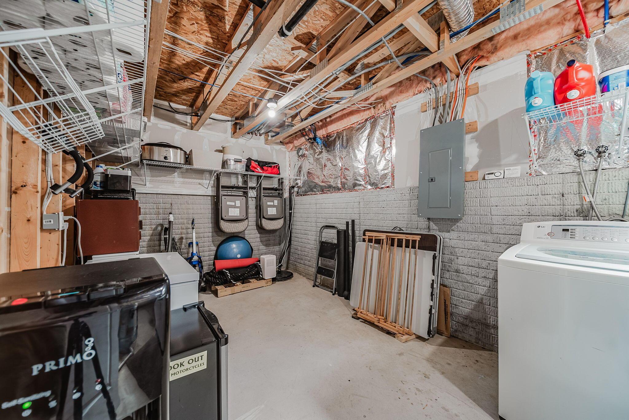 6186 Needletail Road, Unit 66 Columbus, OH 43230 - Photo 28 of 48 Unfinished section of lower level showcases ample storage, access to mechanicals, and washer dryer space!