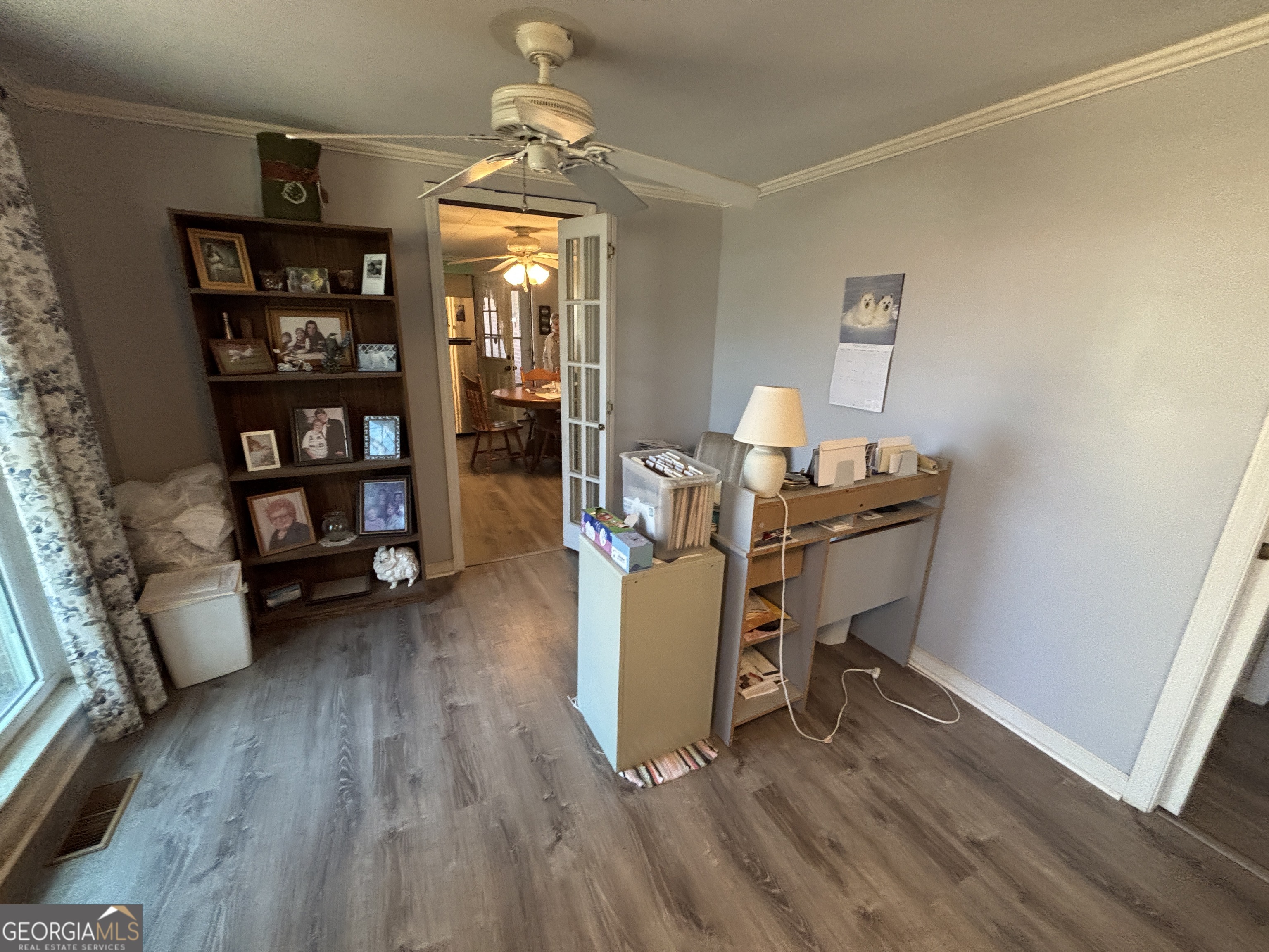 216 East Peter Street Cochran, GA 31014 - Photo 11 of 44 a view of a workspace with furniture and a window