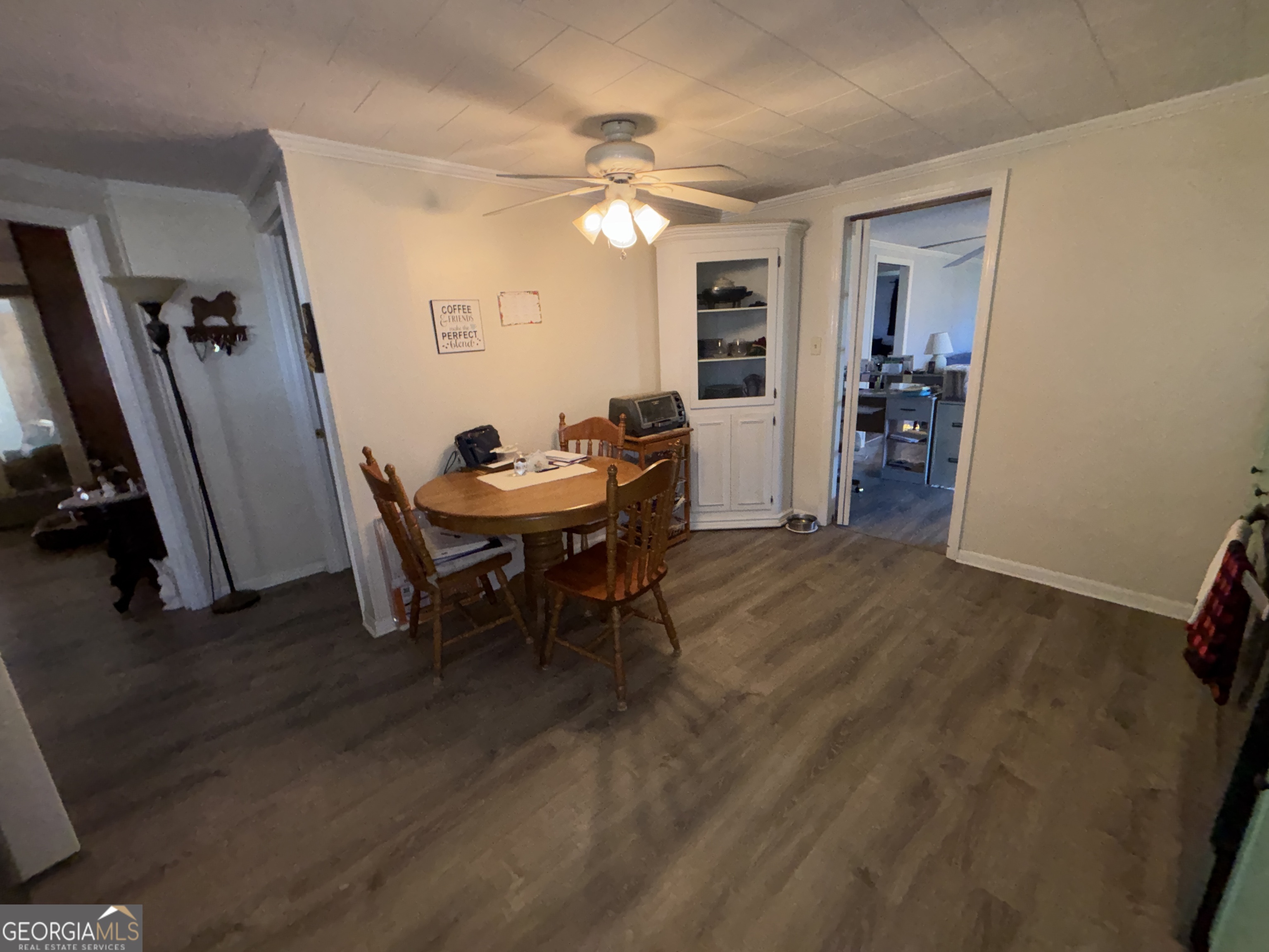 216 East Peter Street Cochran, GA 31014 - Photo 17 of 44 a view of a room with furniture and wooden floor