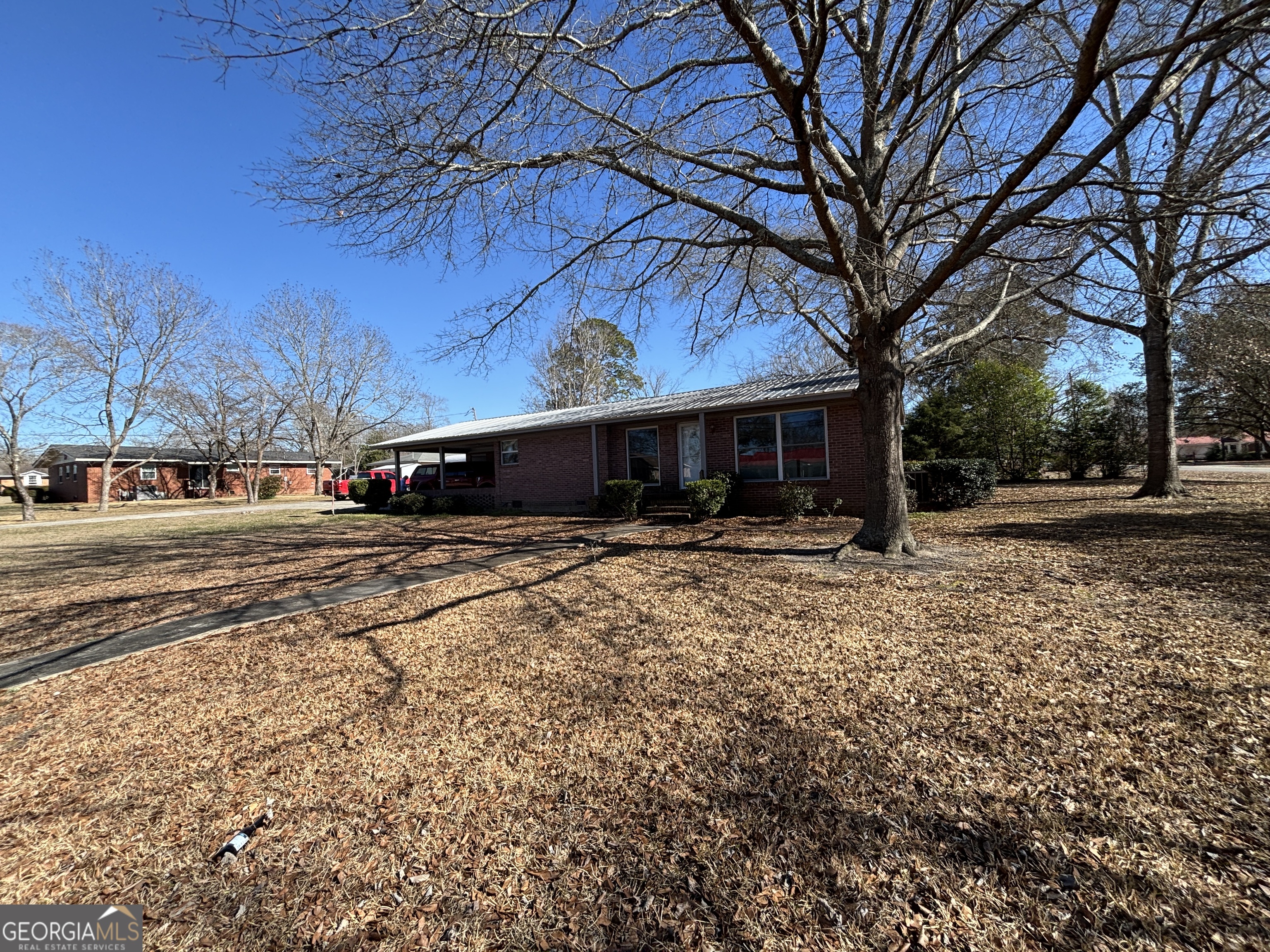 216 East Peter Street Cochran, GA 31014 - Photo 2 of 44 a view of a house with a yard