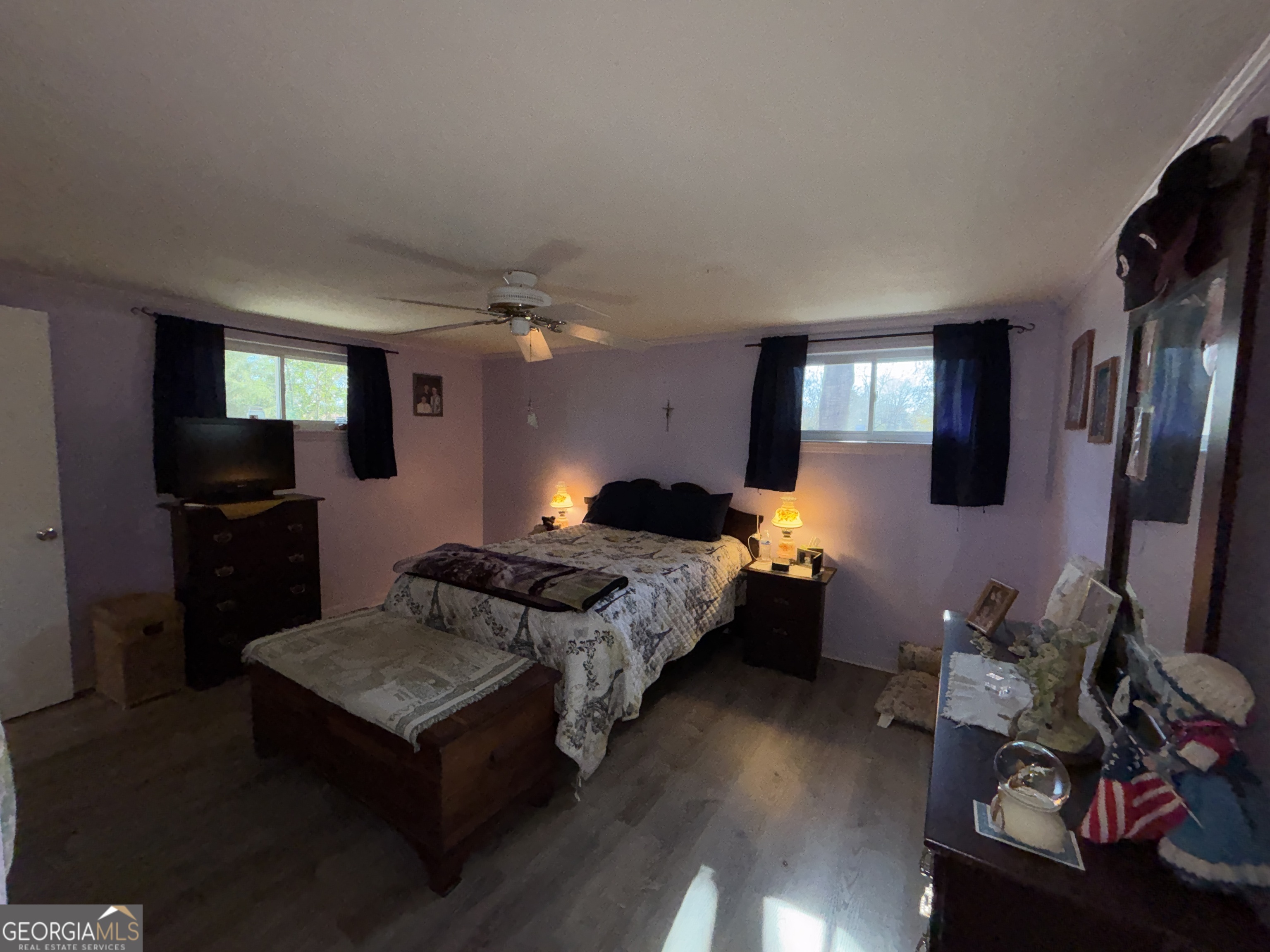 216 East Peter Street Cochran, GA 31014 - Photo 21 of 44 a bed room with furniture and a flat screen tv