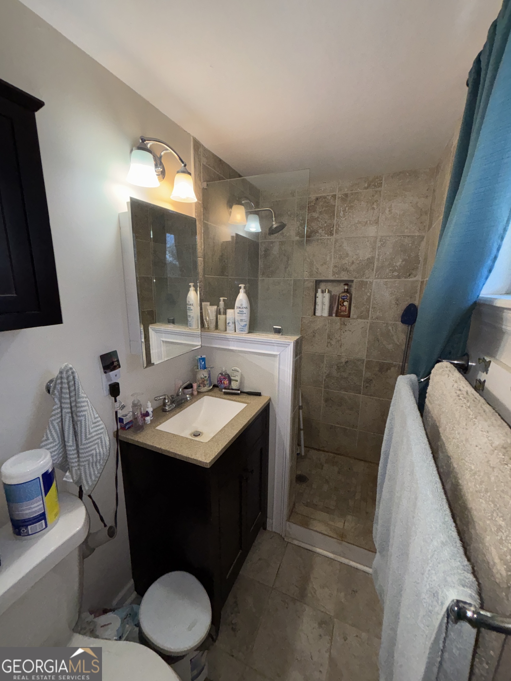 216 East Peter Street Cochran, GA 31014 - Photo 25 of 44 a bathroom with a sink toilet and mirror