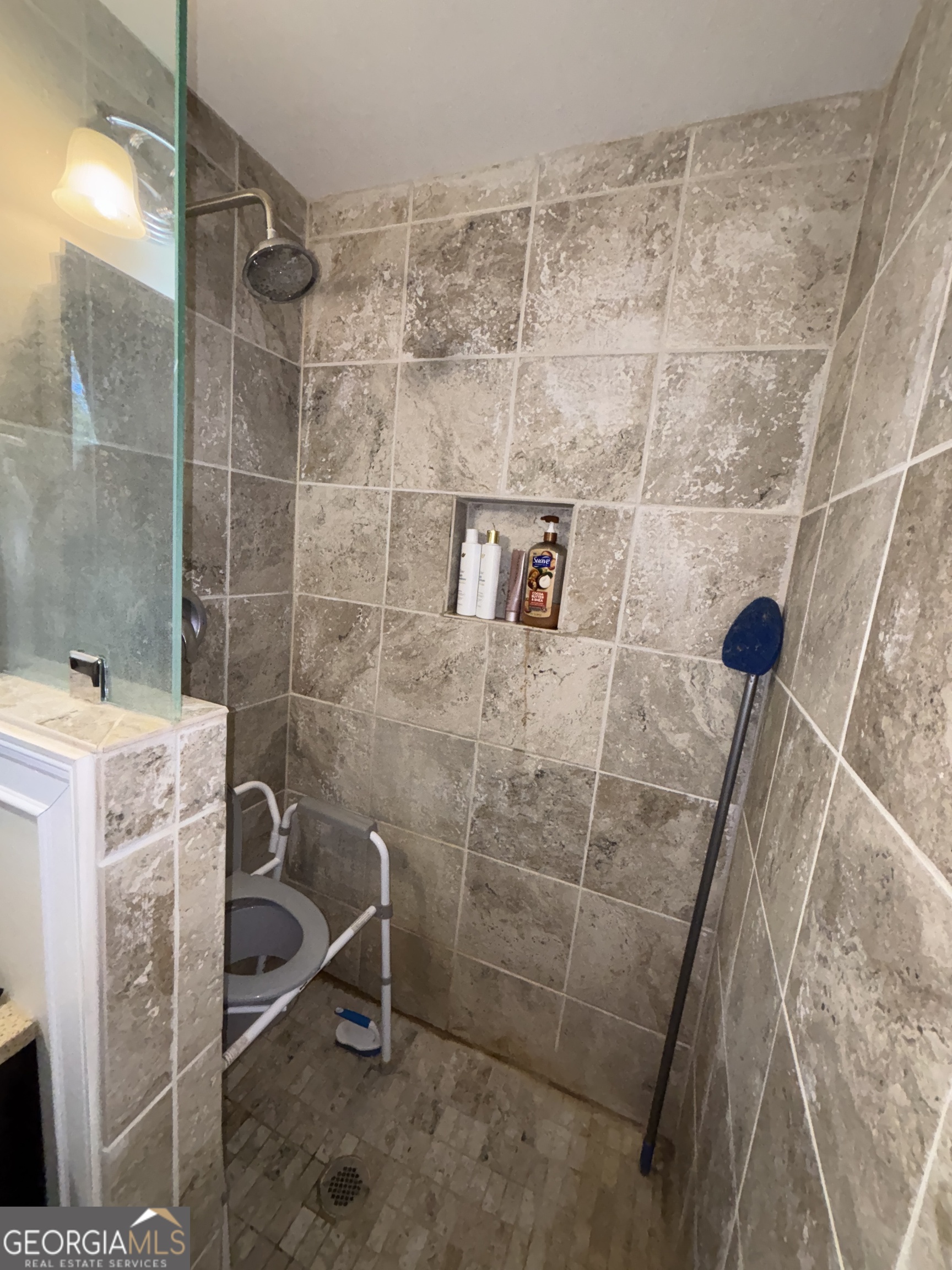 216 East Peter Street Cochran, GA 31014 - Photo 26 of 44 a bathroom with a shower and a sink