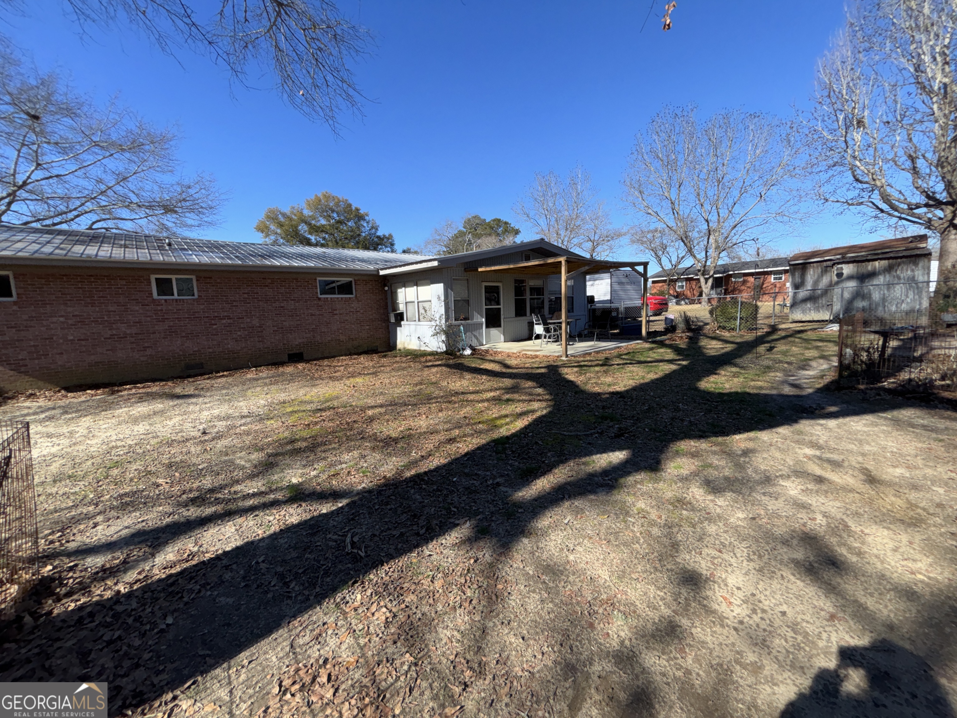 216 East Peter Street Cochran, GA 31014 - Photo 36 of 44 a view of a yard with cars