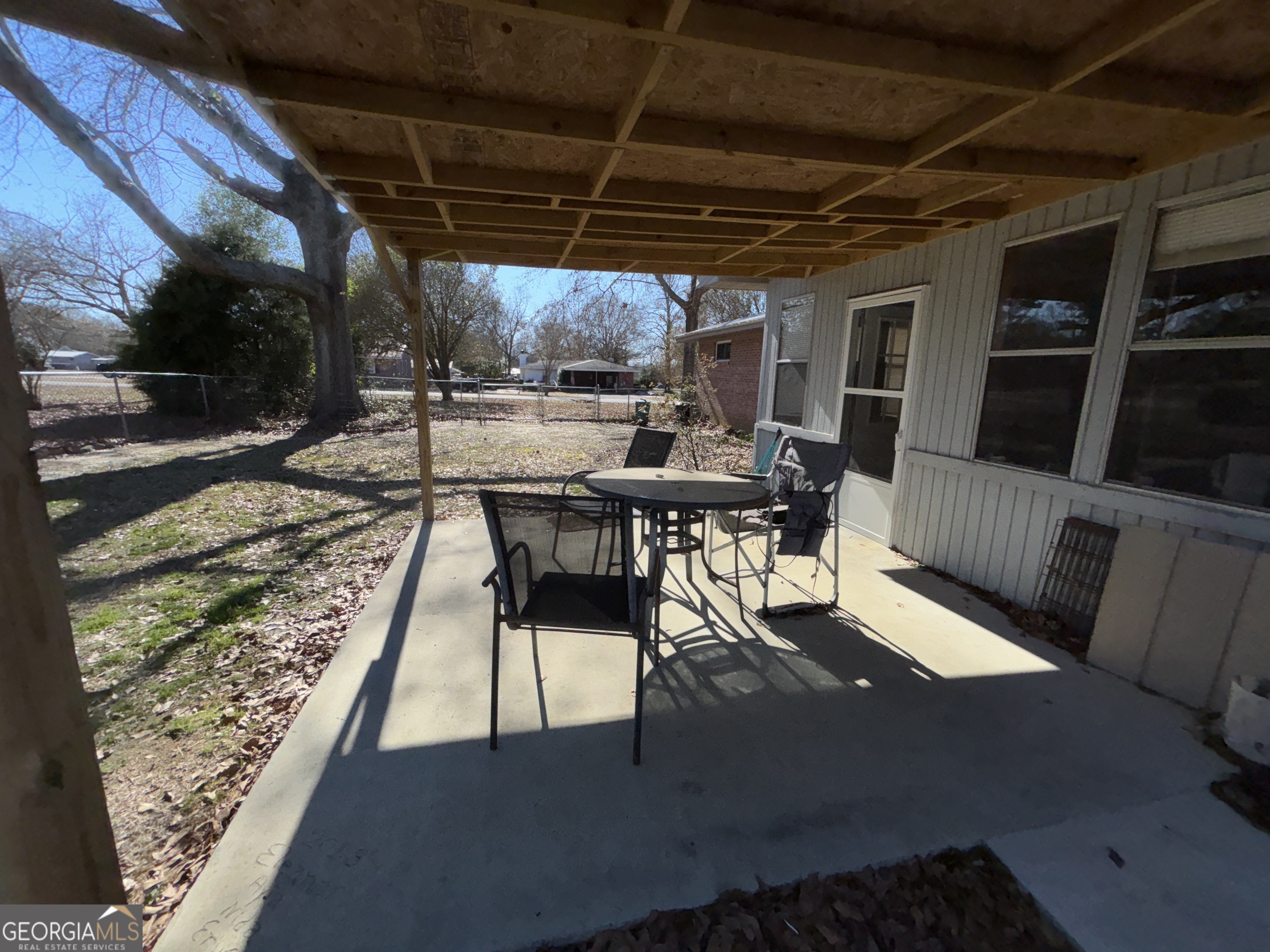 216 East Peter Street Cochran, GA 31014 - Photo 40 of 44 a view of a backyard with sitting area