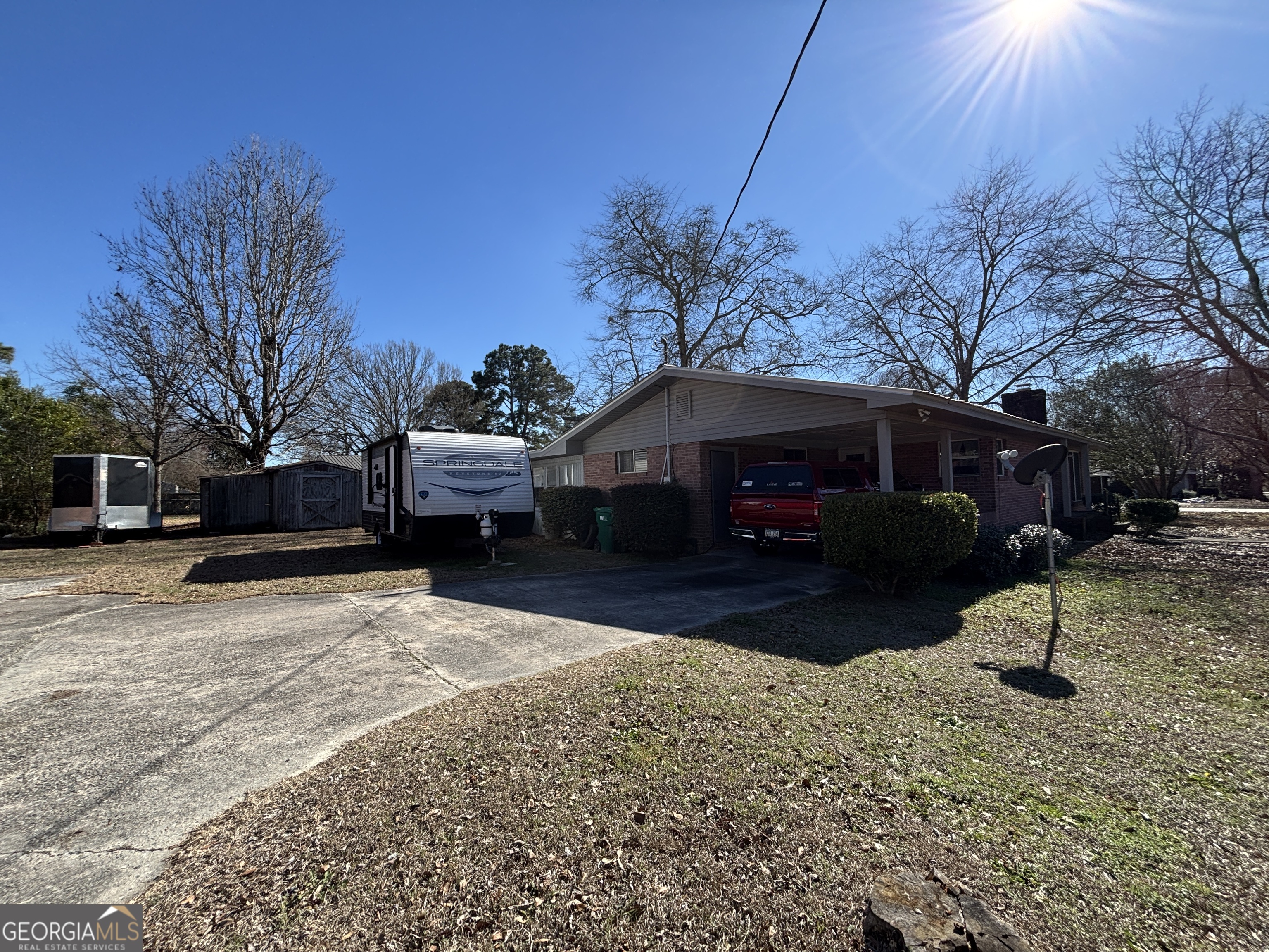 216 East Peter Street Cochran, GA 31014 - Photo 4 of 44 a front view of a house with a yard covered in snow