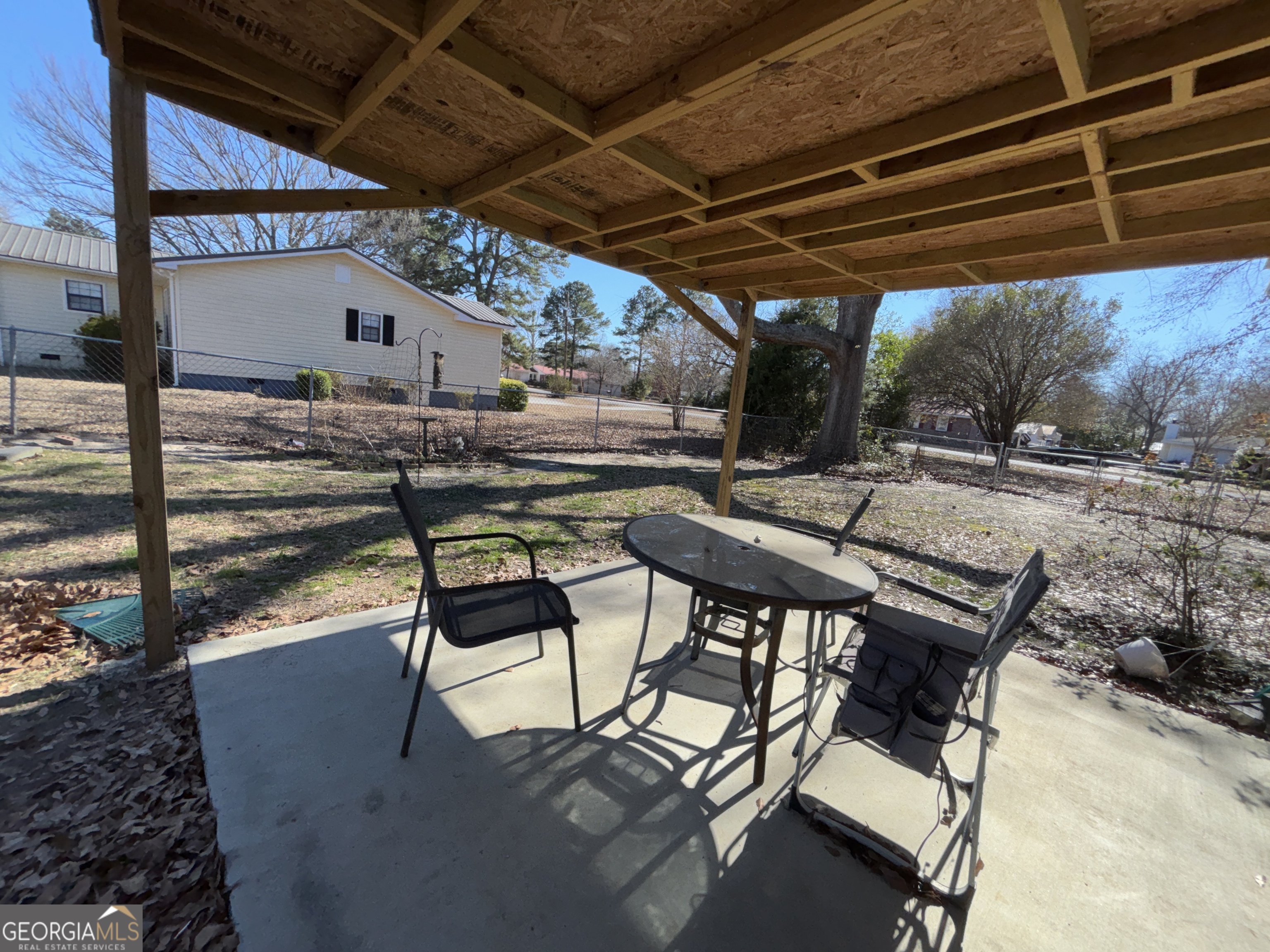 216 East Peter Street Cochran, GA 31014 - Photo 41 of 44 a patio with a table and chairs