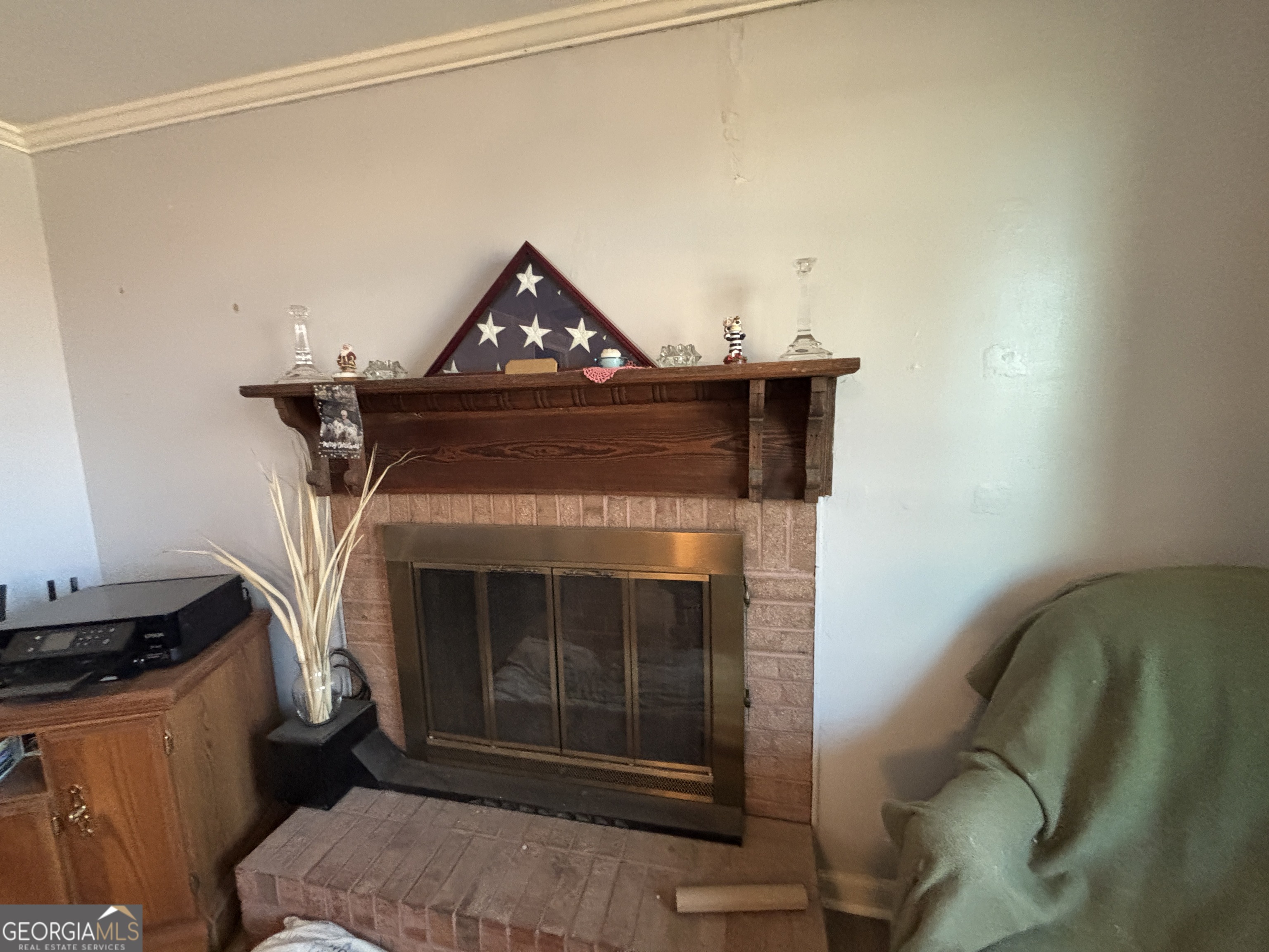 216 East Peter Street Cochran, GA 31014 - Photo 5 of 44 a living room with furniture and a fireplace