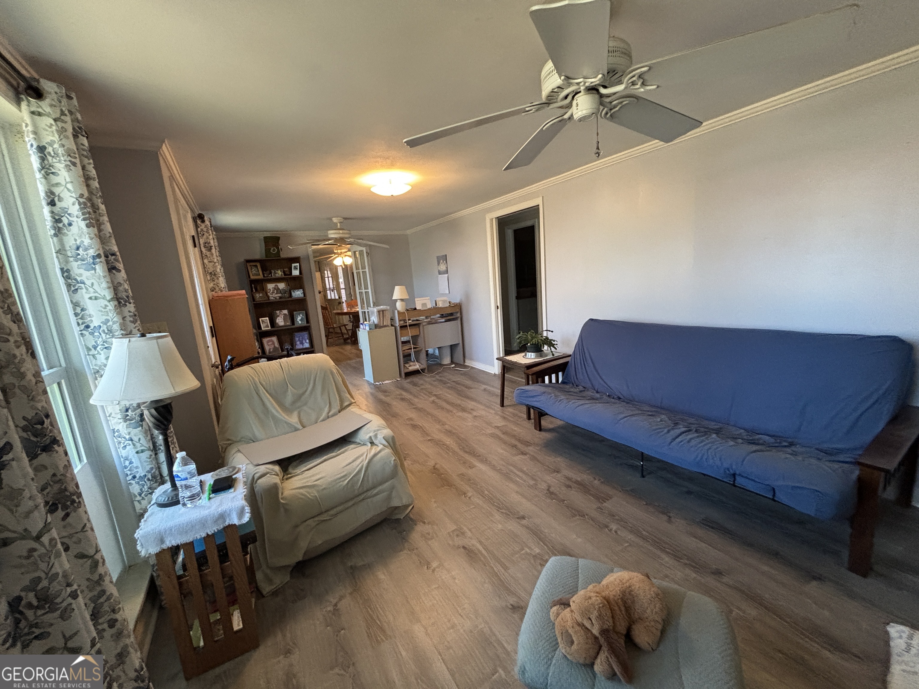 216 East Peter Street Cochran, GA 31014 - Photo 6 of 44 a living room with furniture and wooden floor