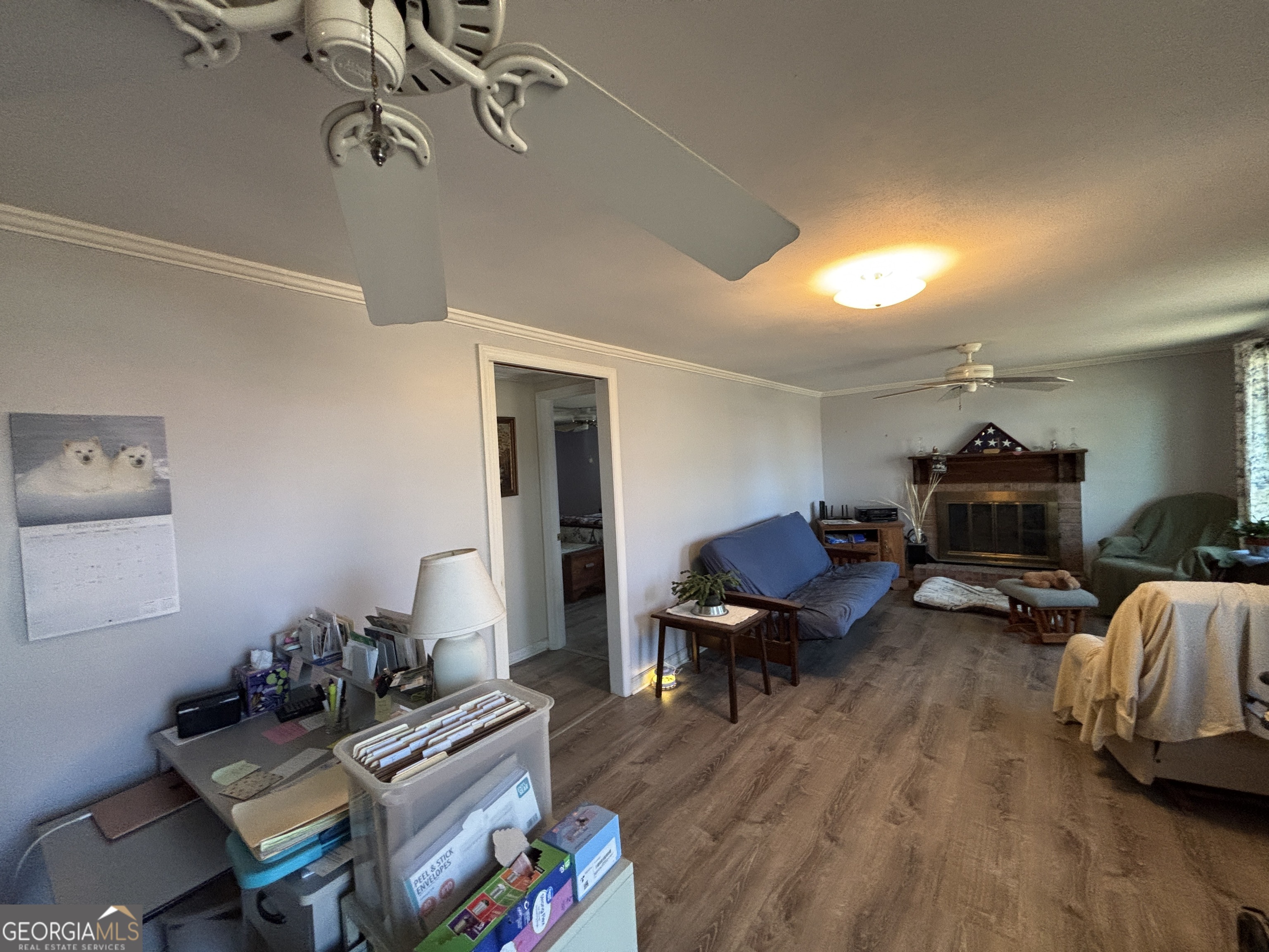 216 East Peter Street Cochran, GA 31014 - Photo 7 of 44 a living room with furniture and a wooden floor