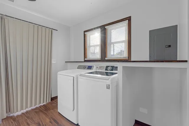 a view of a hallway with washer and dryer