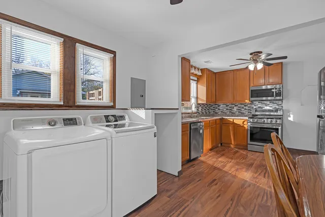 a kitchen with a stove oven and sink