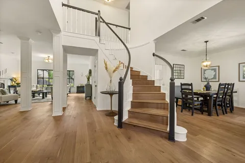 a view of a livingroom with furniture and wooden floor