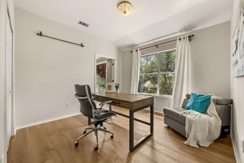 a workspace with furniture and a window