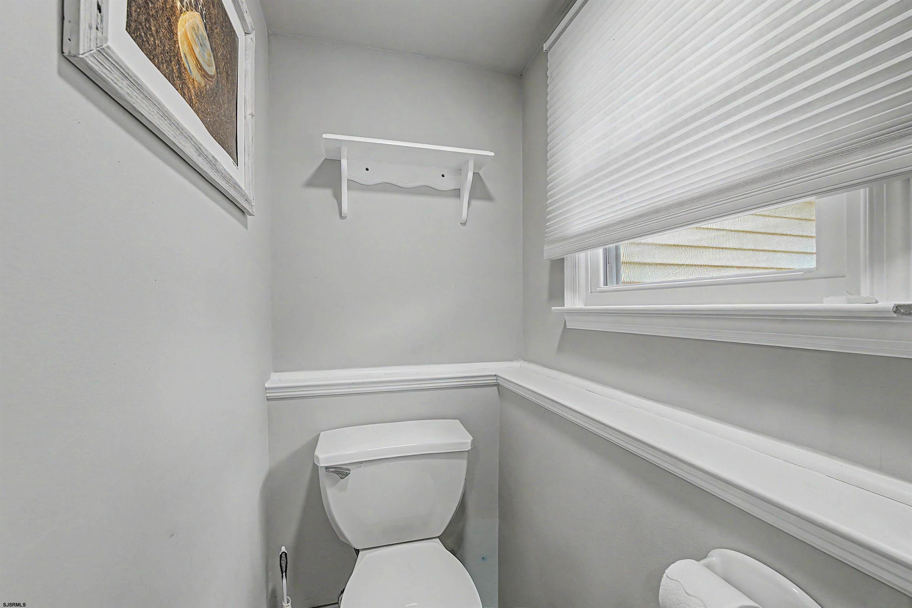 125 Exton Road Somers Point, NJ 08244 - Photo 33 of 35 a bathroom with a toilet and a window