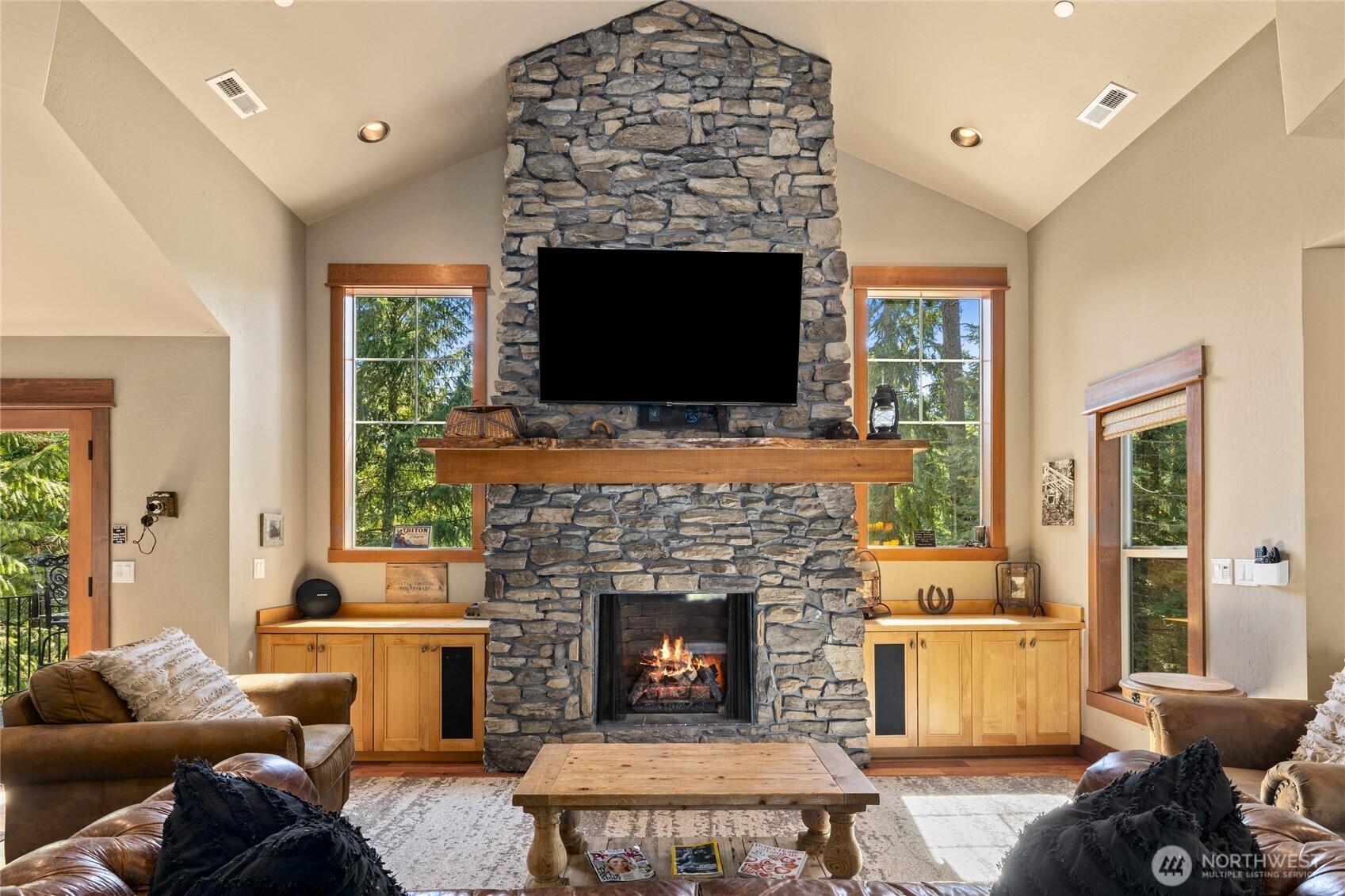 110 Larkspur Loop Cle Elum, WA 98922 - Photo 11 of 40 a living room with furniture a flat screen tv and a fireplace