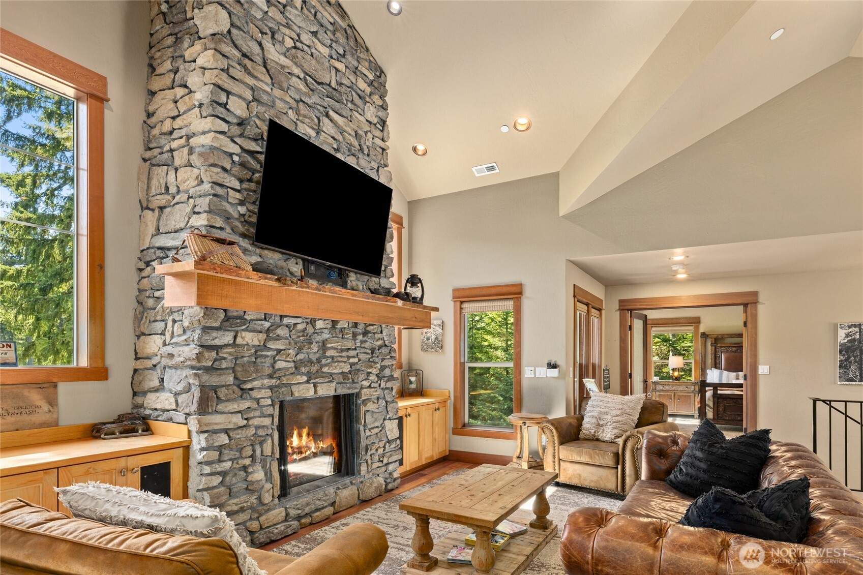 110 Larkspur Loop Cle Elum, WA 98922 - Photo 12 of 40 a living room with furniture a fireplace and a flat screen tv