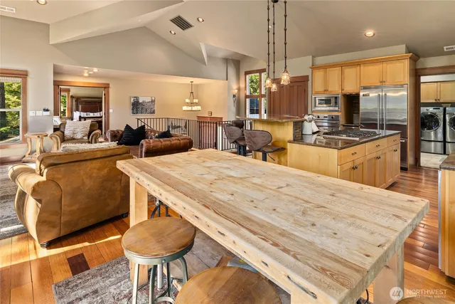 a large bedroom with furniture and a large window