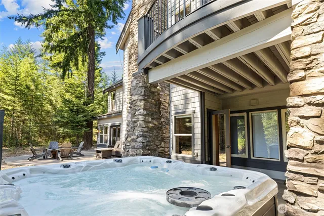 a view of a patio with table and chairs and potted plants