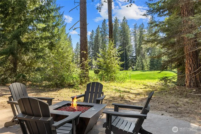 a view of a chairs and table in patio