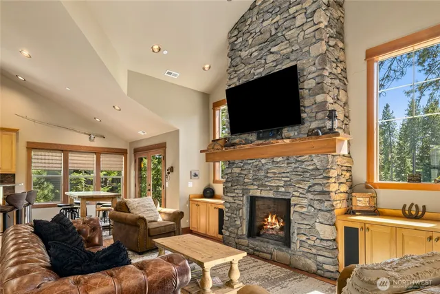 a living room with furniture fireplace and flat screen tv
