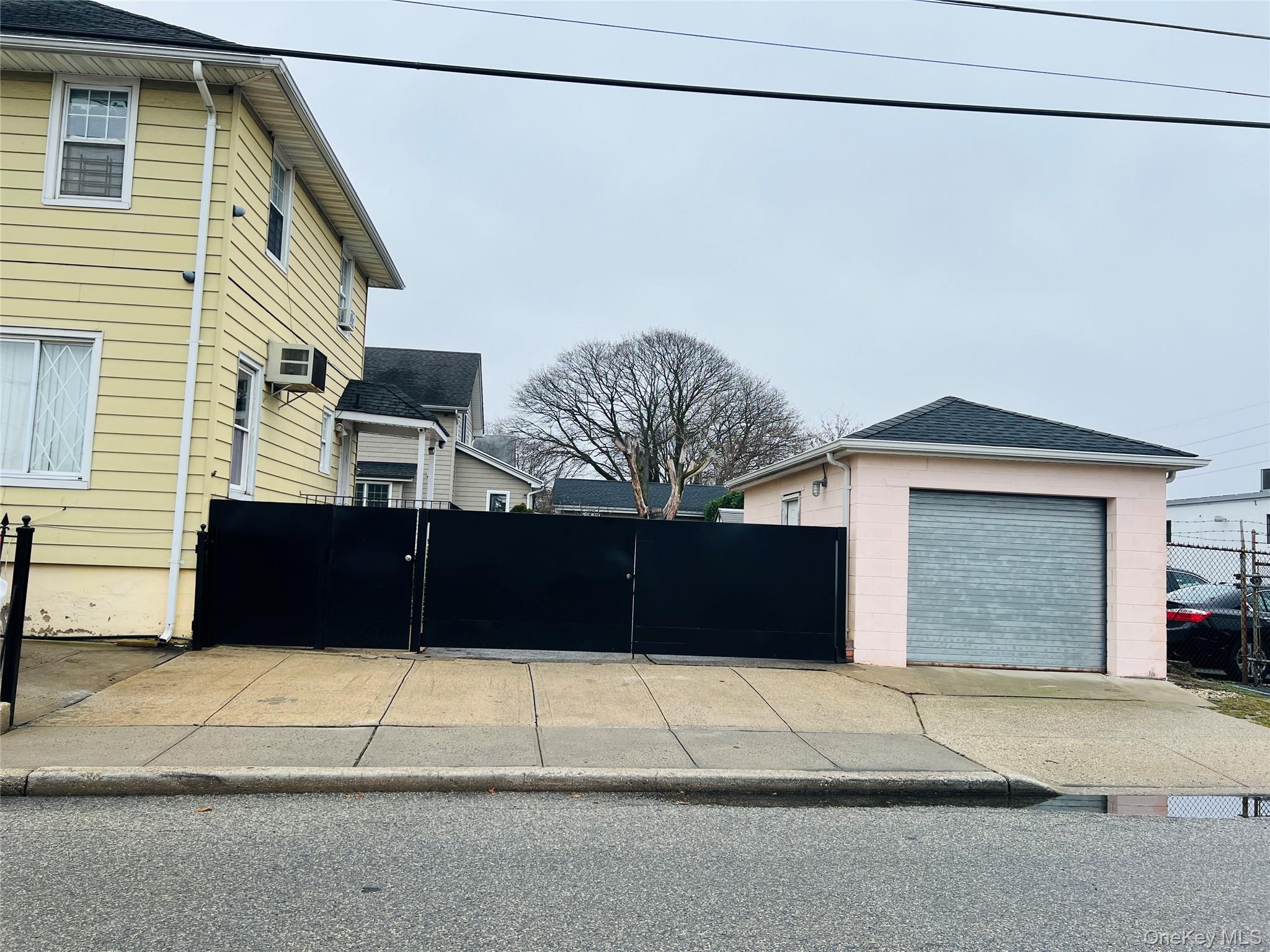 83 Roger Avenue Inwood, NY 11096 - Photo 6 of 6 a house view with a outdoor space