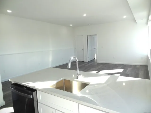 a kitchen with a sink and cabinets