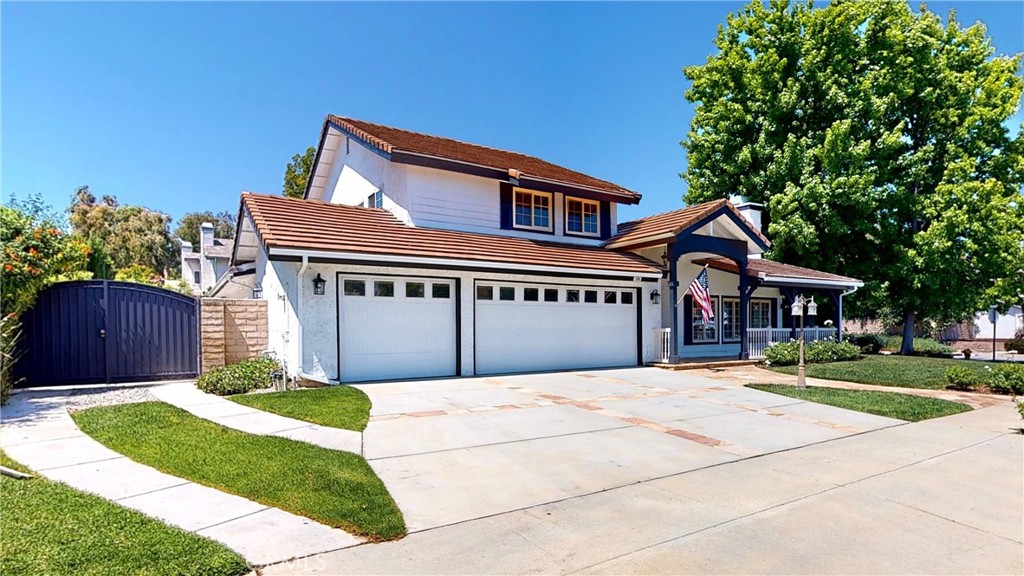 3185 Avenida Simi Simi Valley, CA 93063 - Photo 1 of 1 a front view of a house with a garden and trees