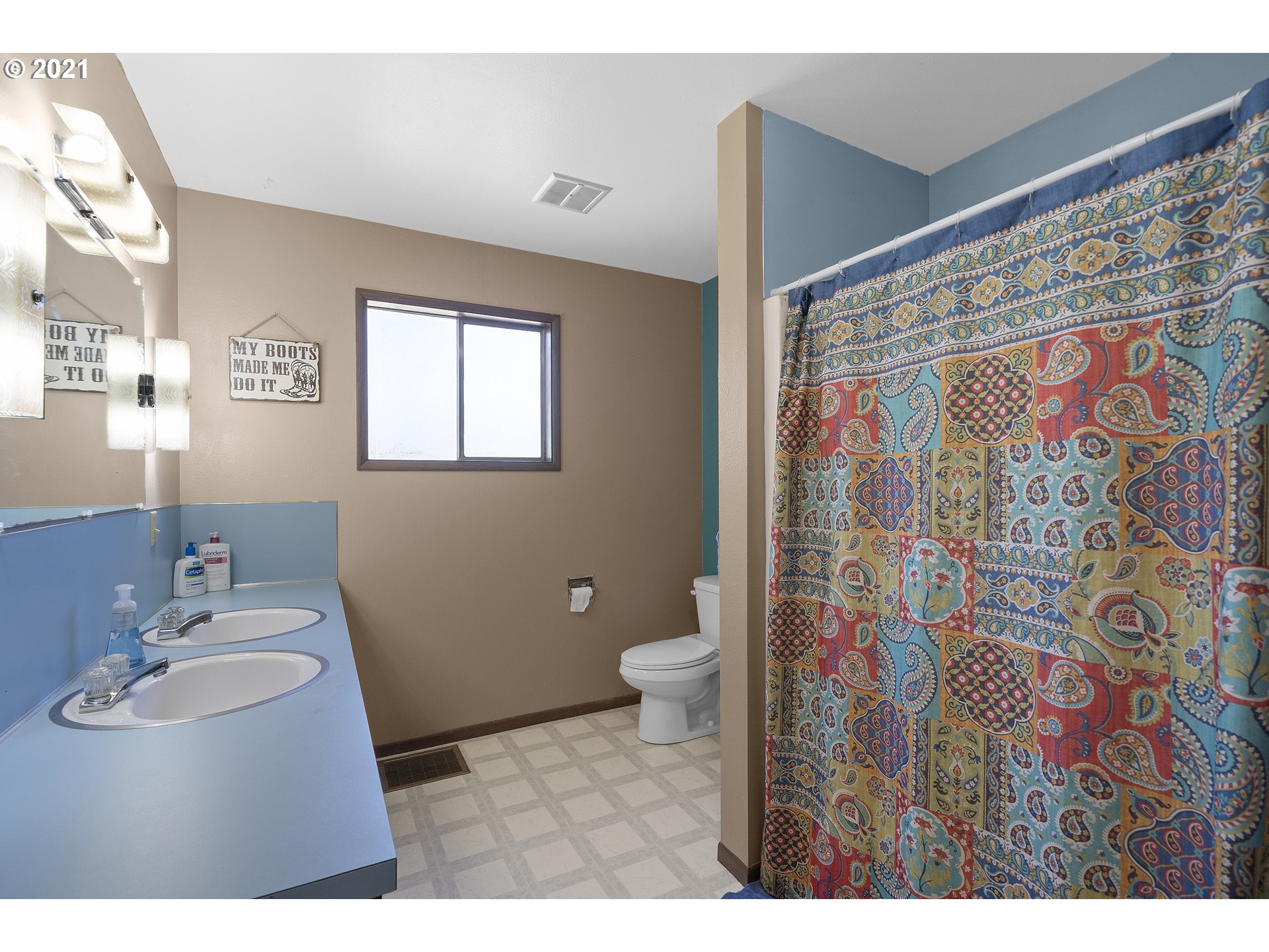 10050 Chance Road Tillamook, OR 97141 - Photo 14 of 31 a bathroom with a sink toilet and shower