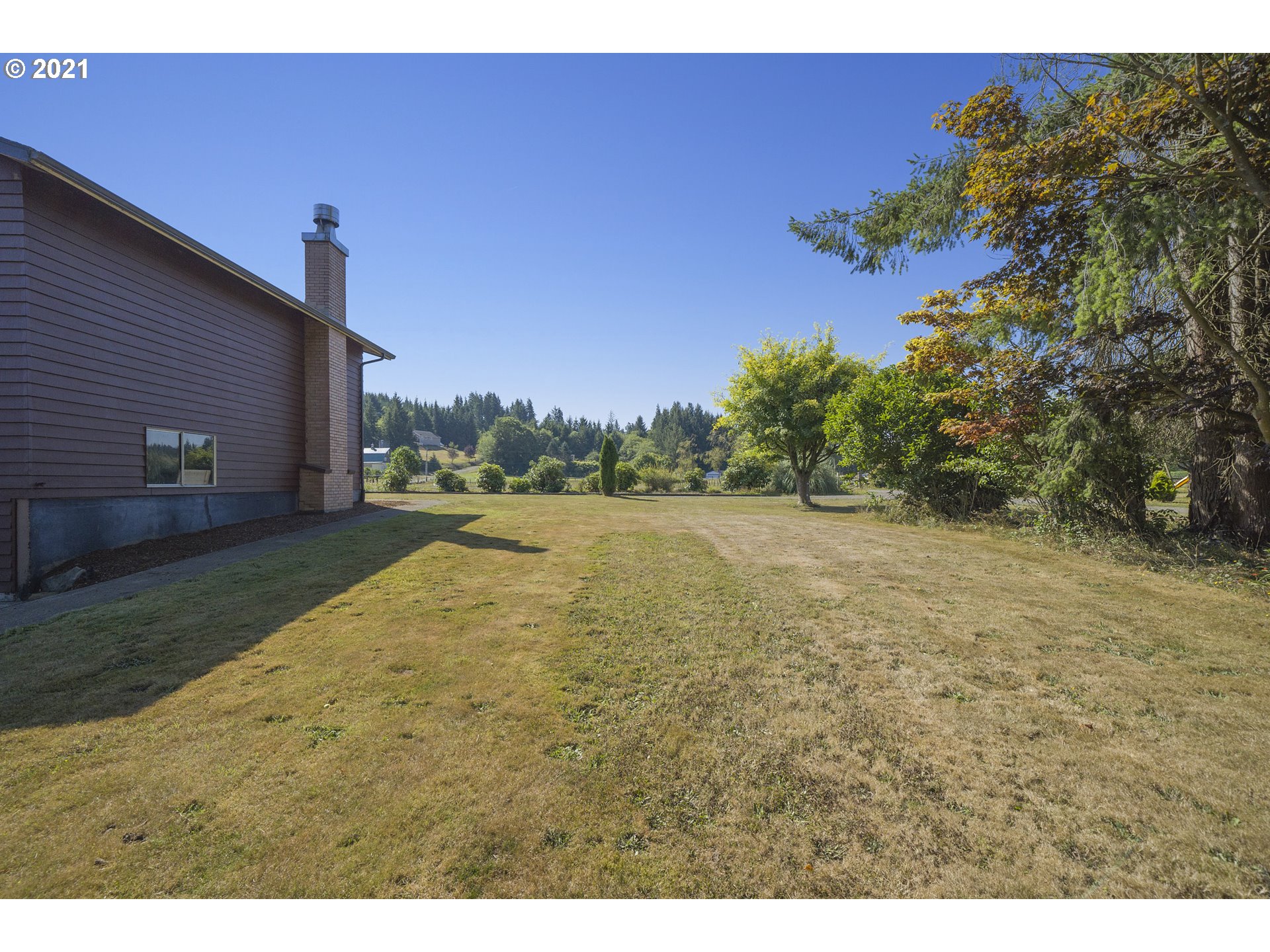 10050 Chance Road Tillamook, OR 97141 - Photo 19 of 31 a view of a yard with a house