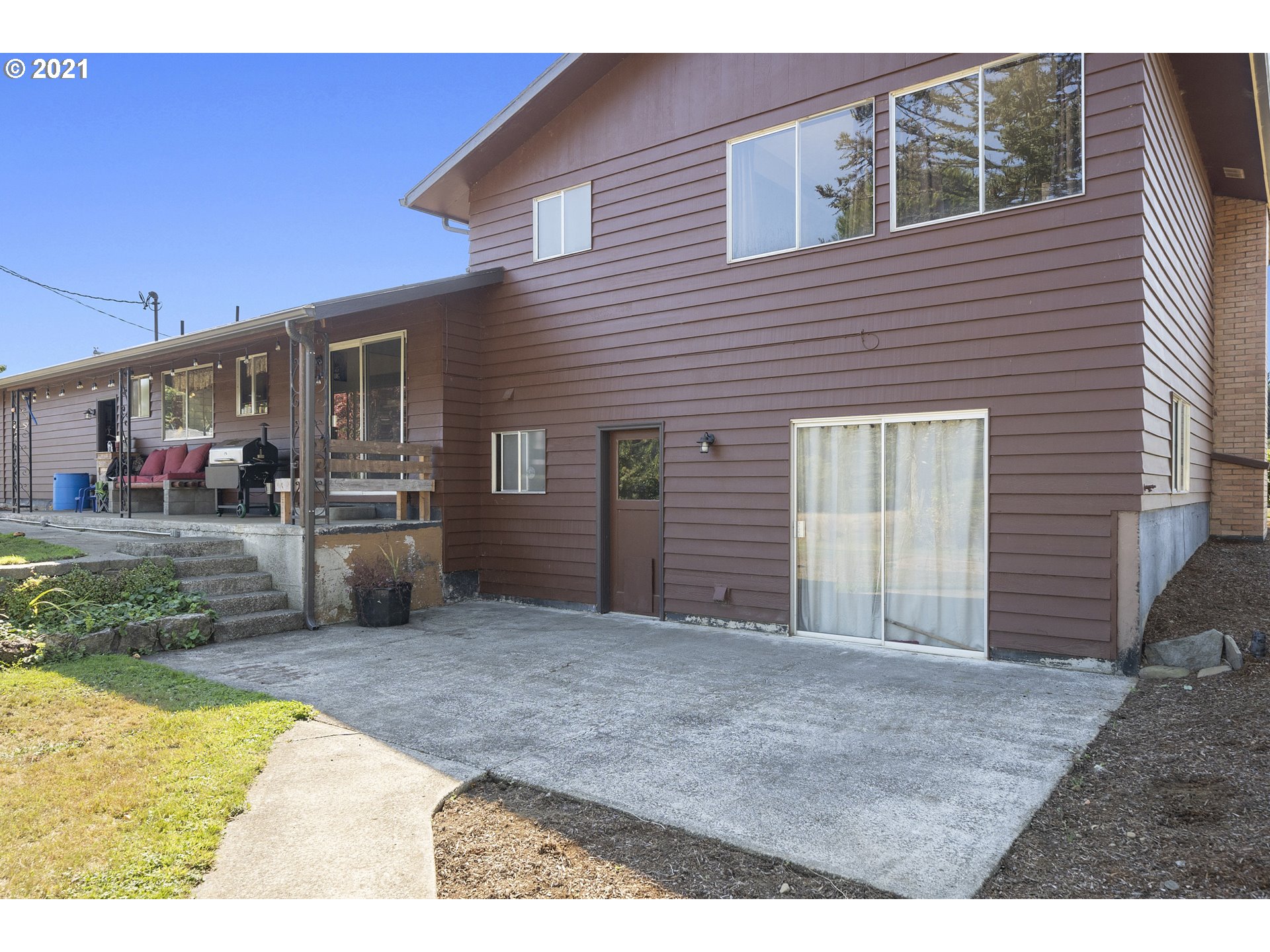10050 Chance Road Tillamook, OR 97141 - Photo 25 of 31 a view of a house with a backyard