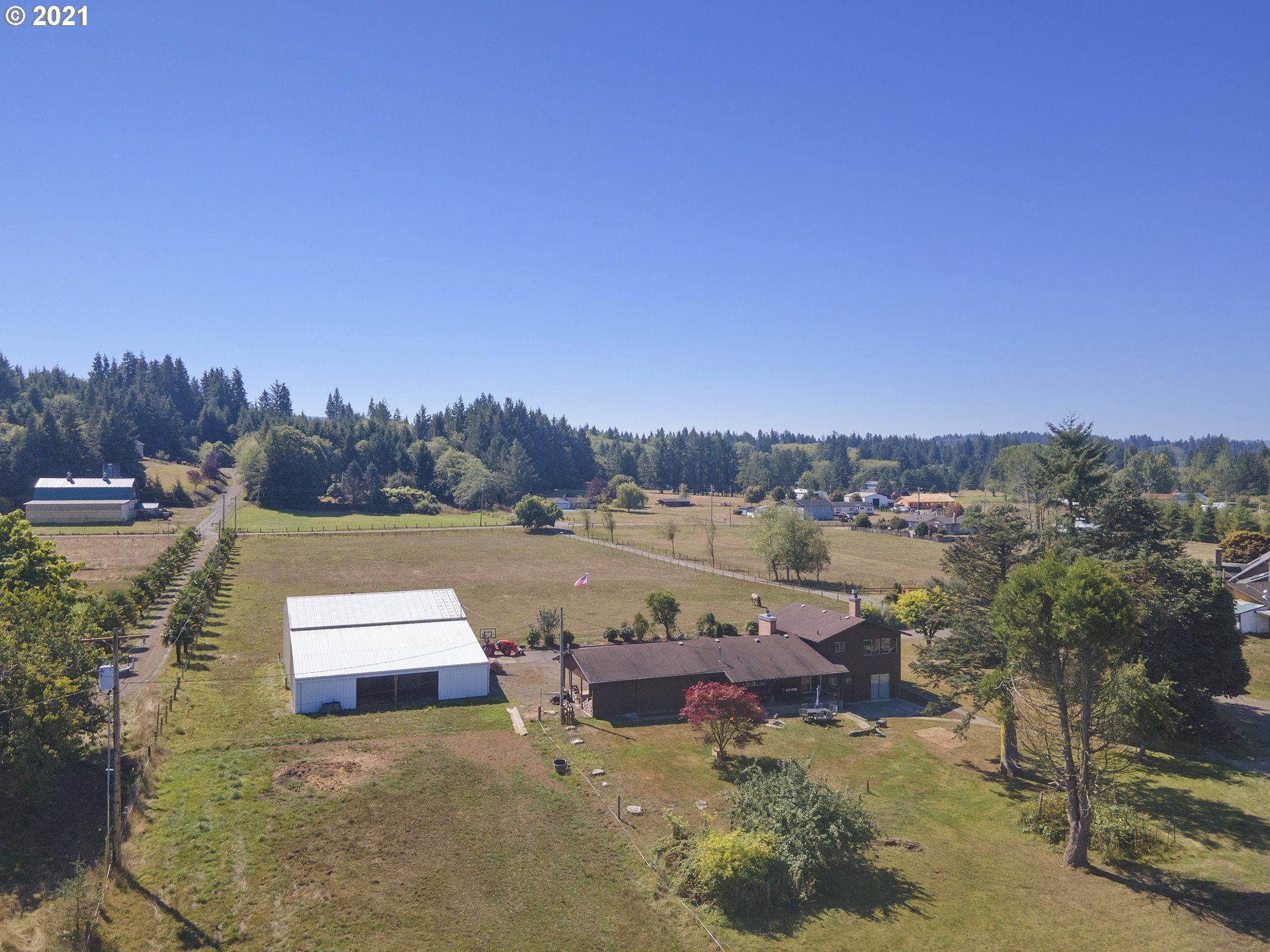 10050 Chance Road Tillamook, OR 97141 - Photo 4 of 31 a view of a lake with houses in the back