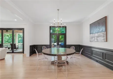a view of an empty room with glass door and a balcony