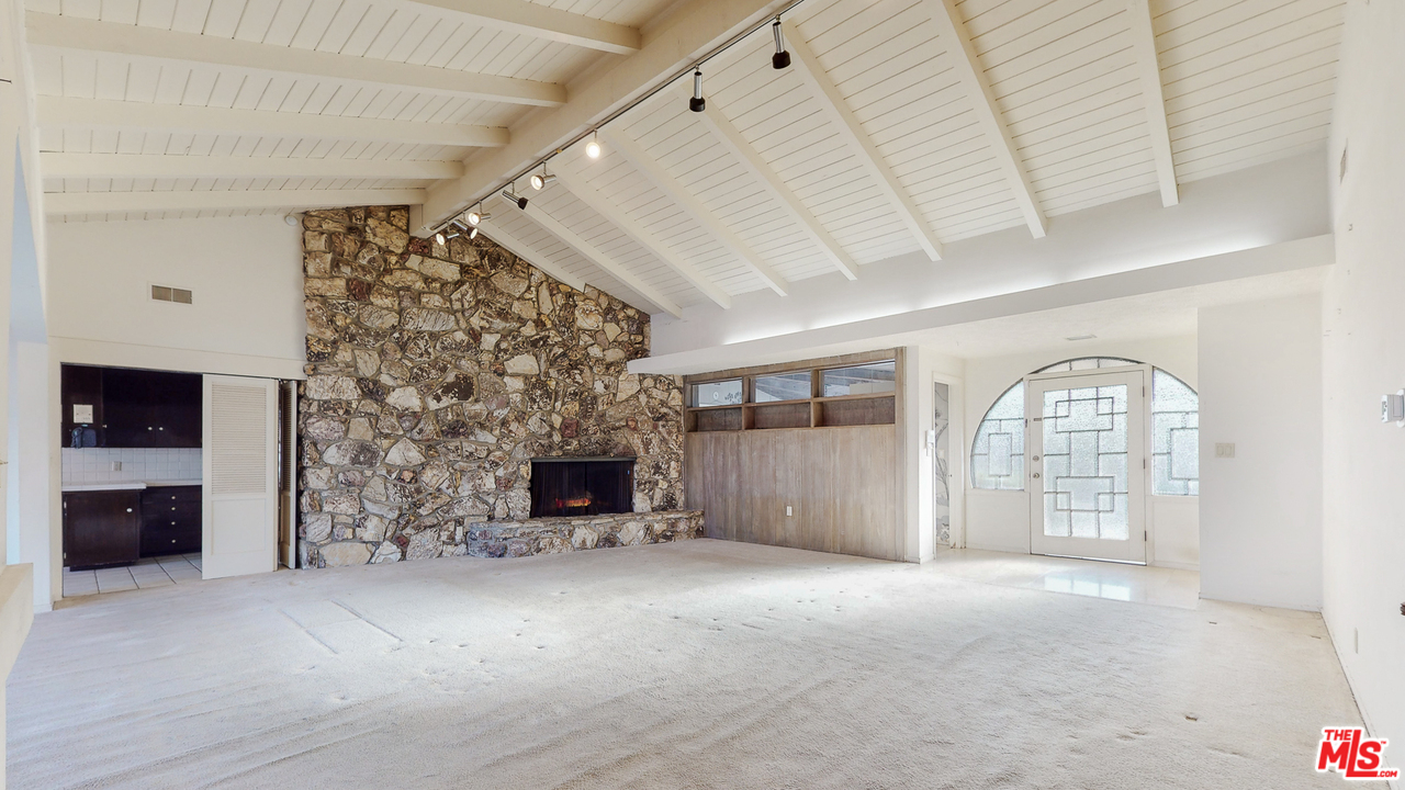 0 Stradella Road Los Angeles, CA 90077 - Photo 11 of 29 a view of a livingroom with an empty space and a fireplace