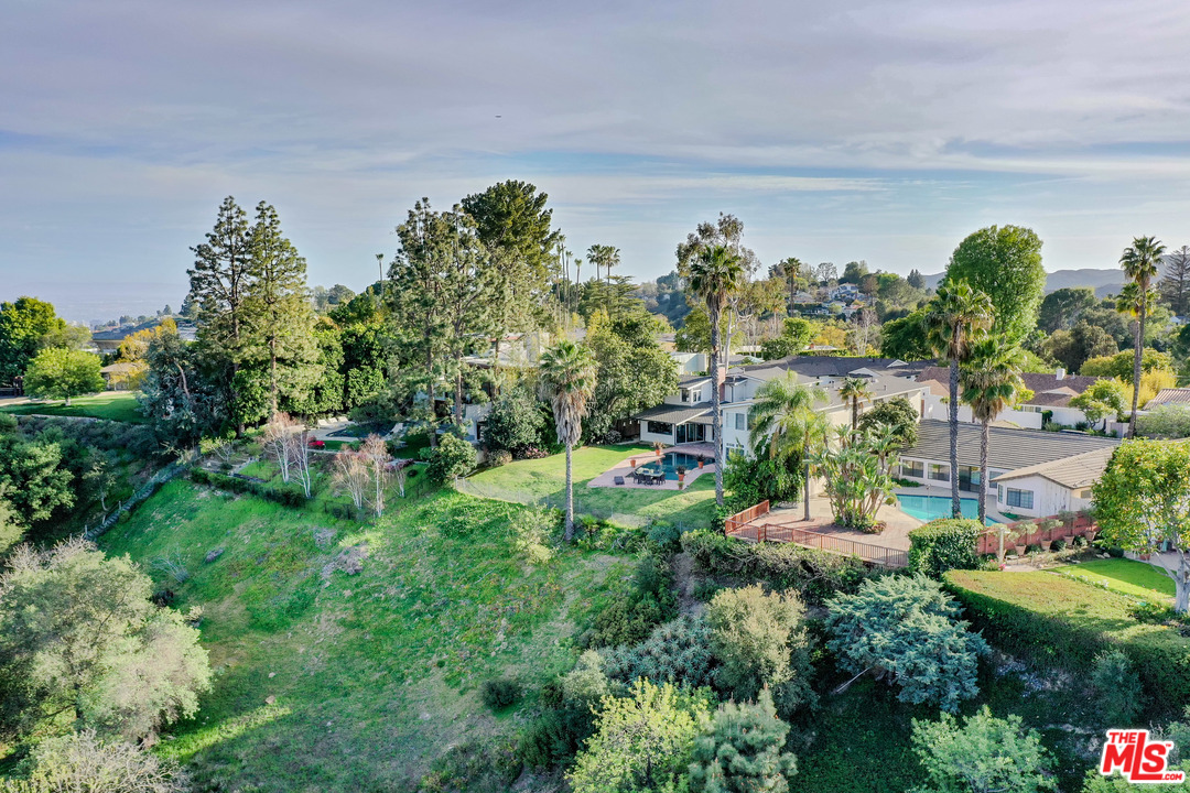 0 Stradella Road Los Angeles, CA 90077 - Photo 3 of 29 a view of a garden with lawn chairs