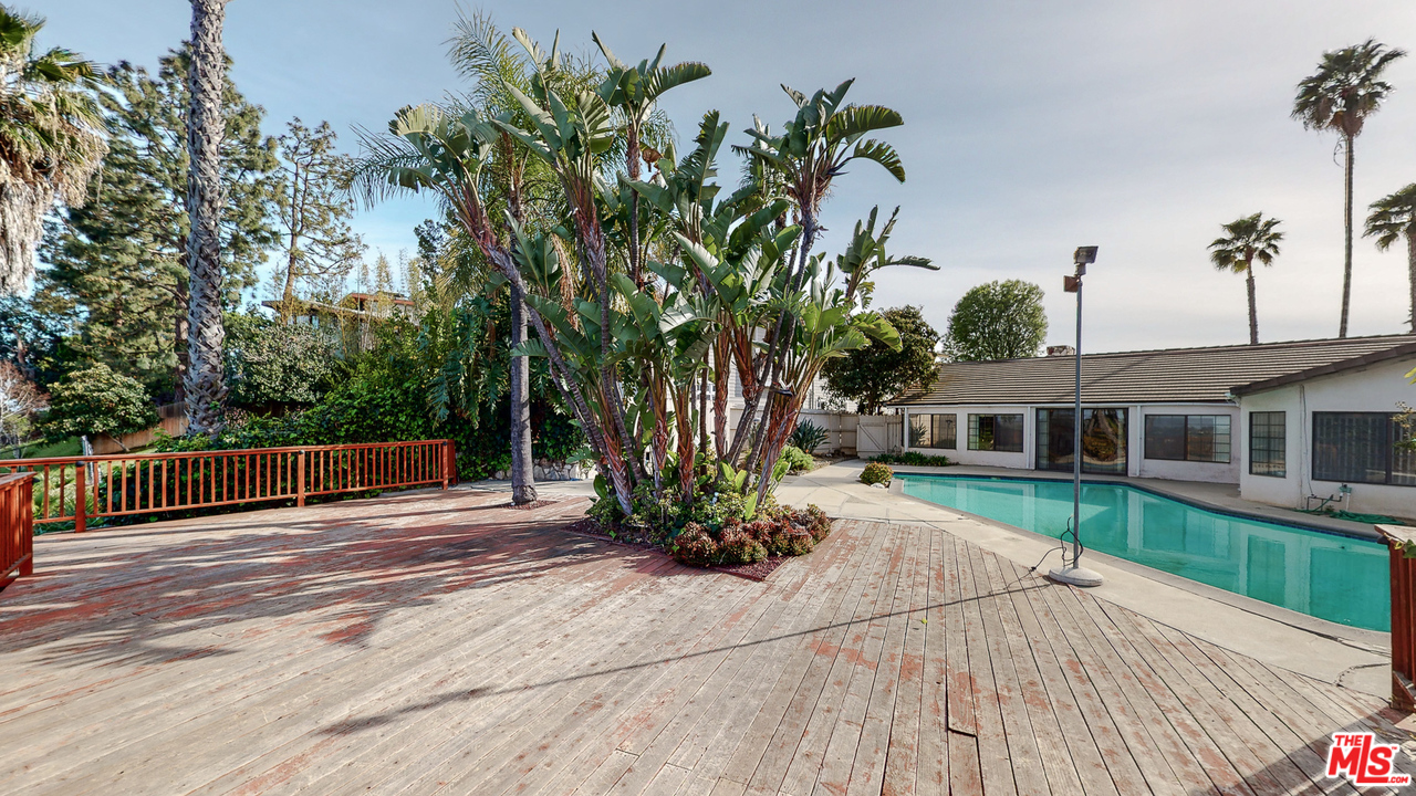 0 Stradella Road Los Angeles, CA 90077 - Photo 25 of 29 a view of a house with backyard and a tree