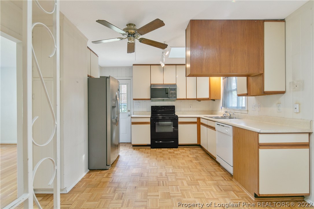 6309 Greyfield Road Fayetteville, NC 28303 - Photo 17 of 45 a open kitchen with stainless steel appliances granite countertop a refrigerator and a sink