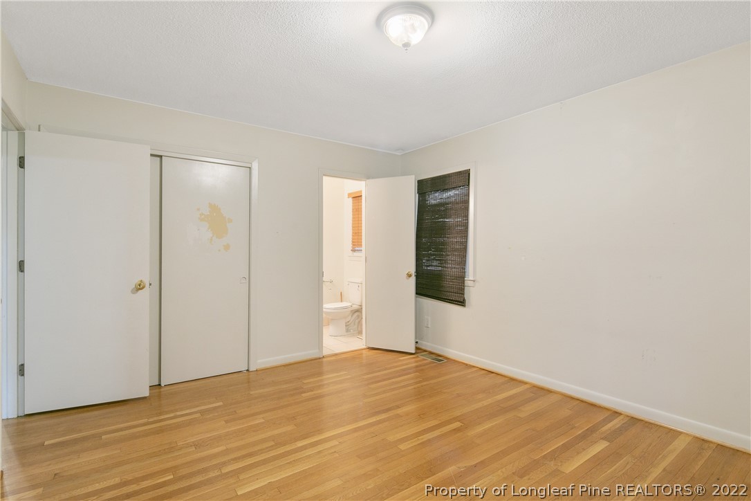 6309 Greyfield Road Fayetteville, NC 28303 - Photo 23 of 45 a view of an empty room with wooden floor