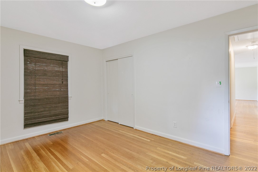6309 Greyfield Road Fayetteville, NC 28303 - Photo 26 of 45 a view of empty room with wooden floor