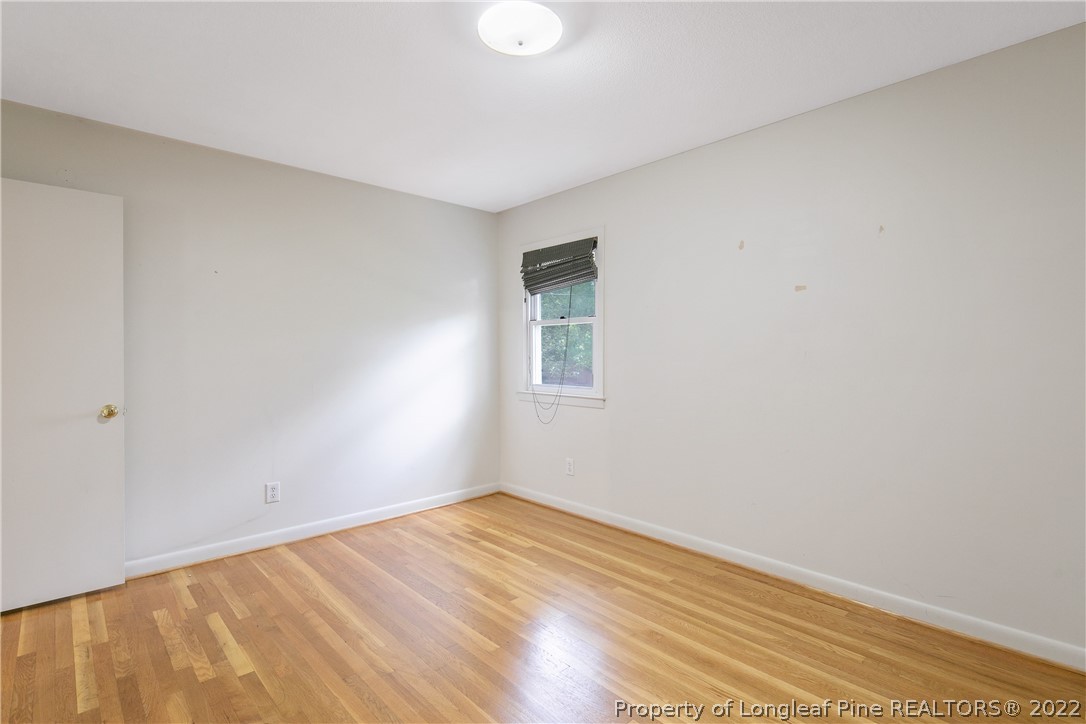 6309 Greyfield Road Fayetteville, NC 28303 - Photo 28 of 45 a view of a room with wooden floor and white walls