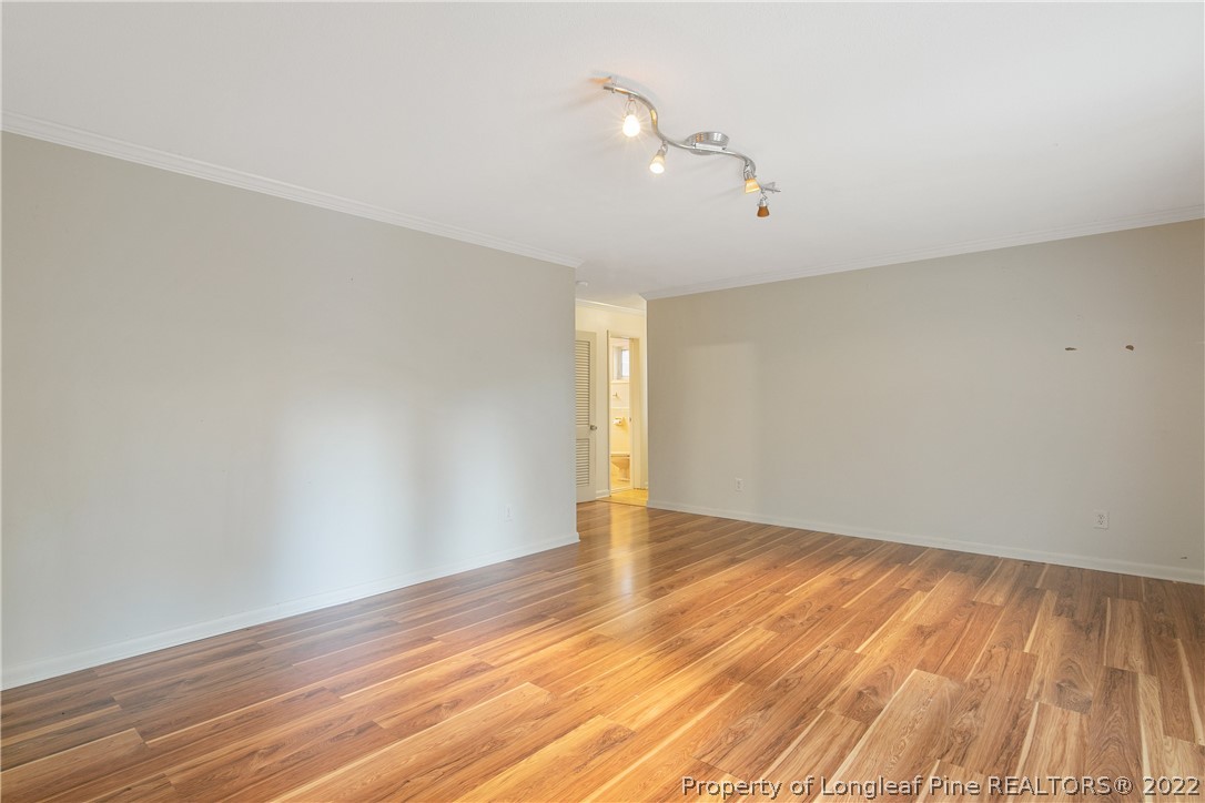 6309 Greyfield Road Fayetteville, NC 28303 - Photo 32 of 45 a view of an empty room with wooden floor