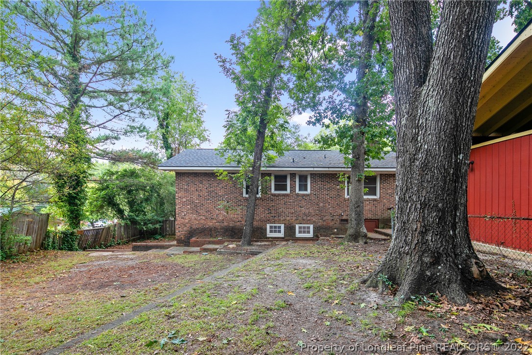 6309 Greyfield Road Fayetteville, NC 28303 - Photo 41 of 45 a view of a house with a yard and large tree